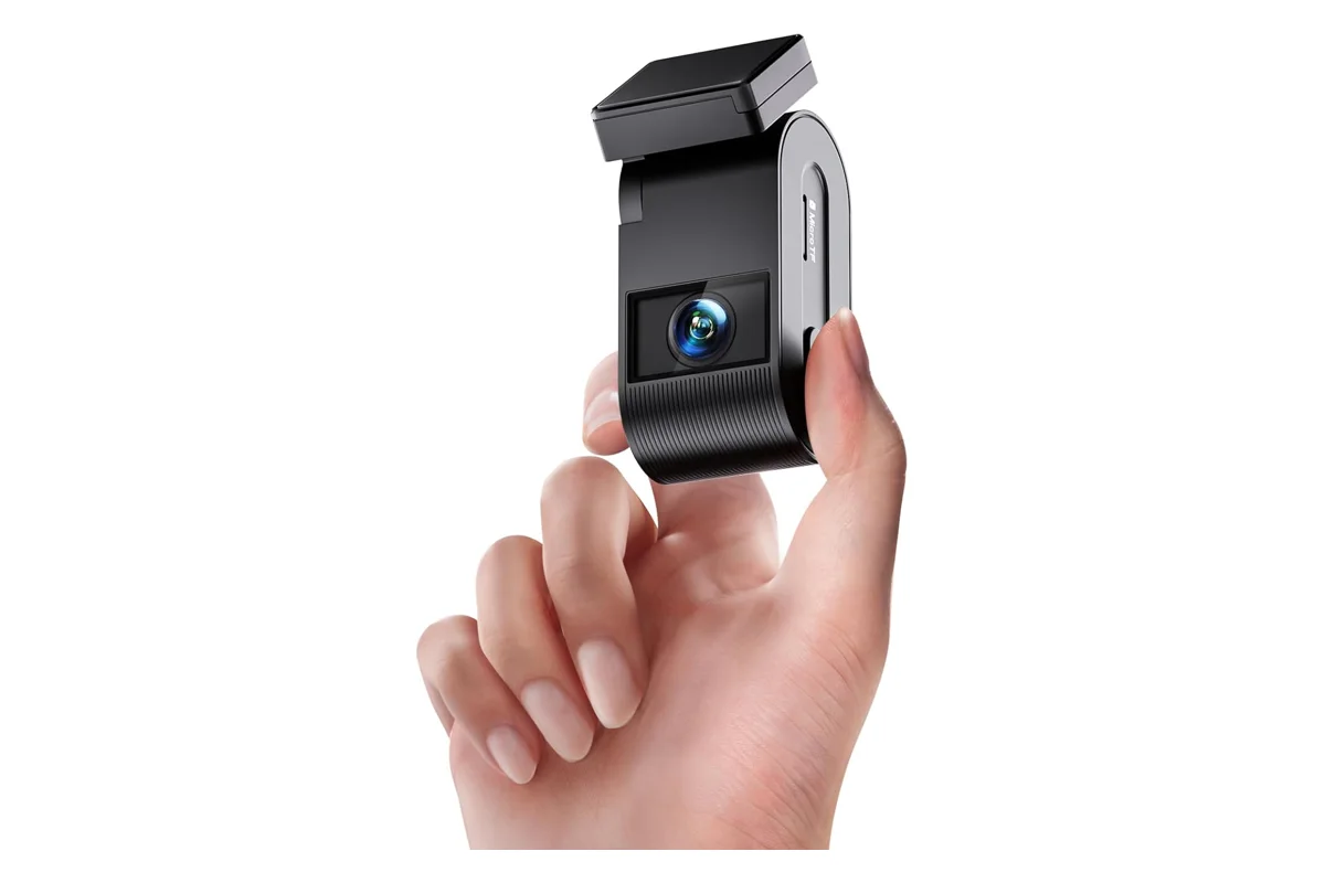 VIOFO VS1 Mini compact dash cam held between two fingers to show its size